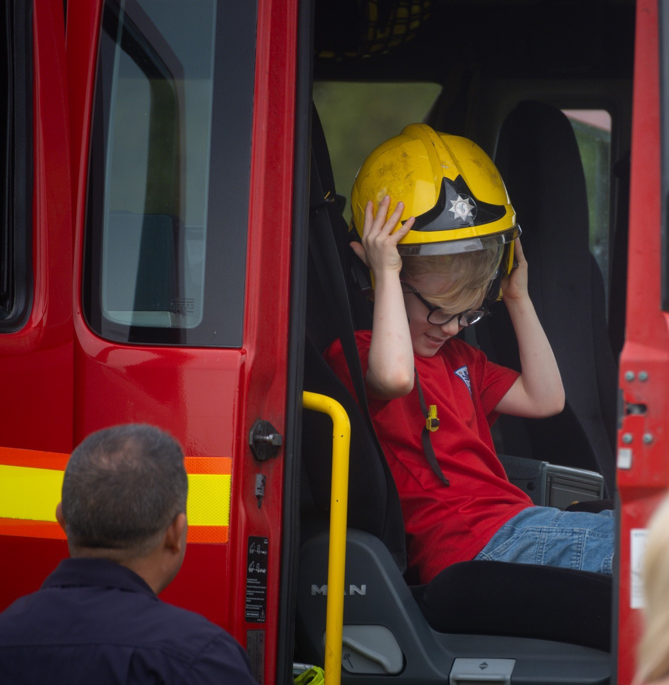 Local child enjoying the fire engine.jpg