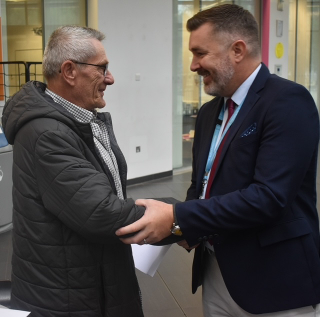 1 Danny Davey is congratulated by Suffolk New College Principal and CEO Alan Pease on his GCSE result in English.JPG