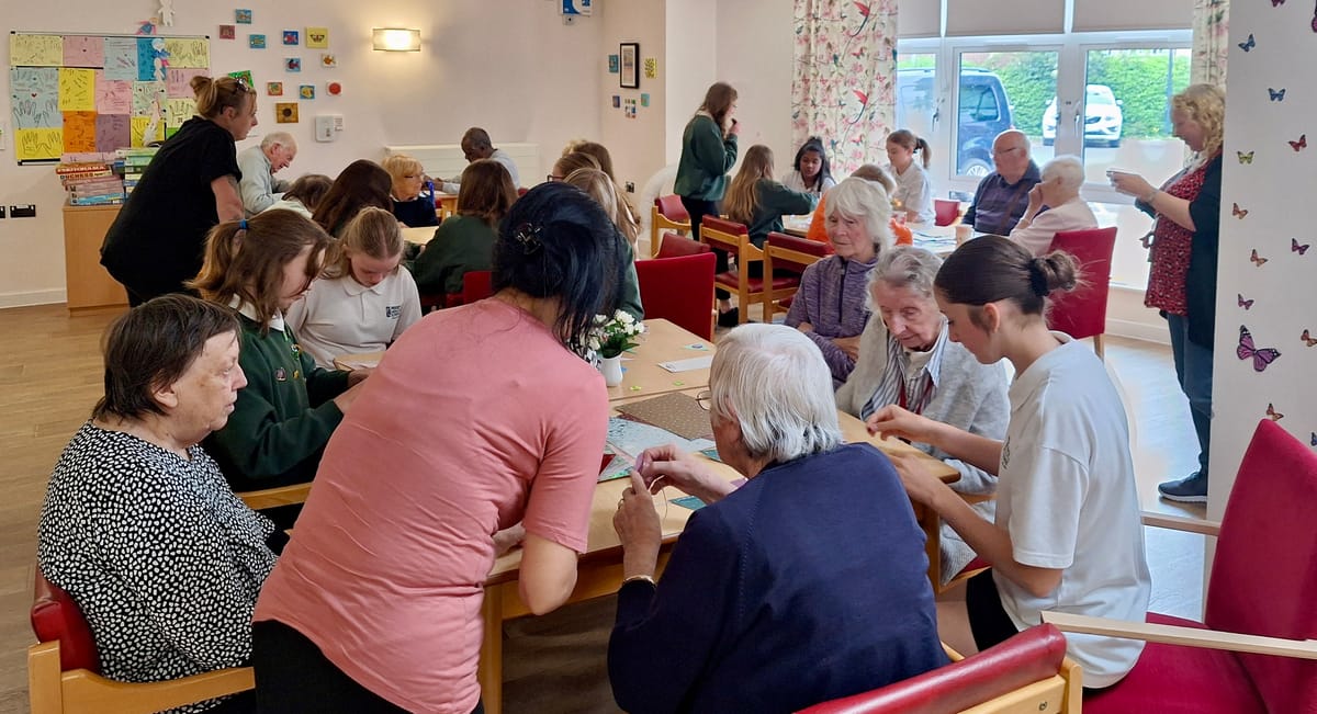 Making bunting together - students and community members with dementia