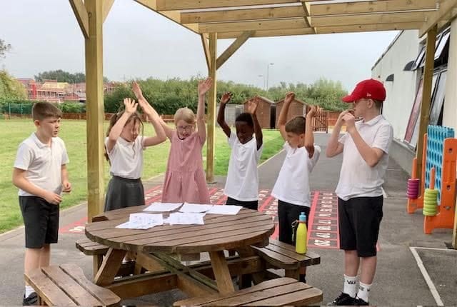 Happy pupils enjoy new outdoor classroom at brilliant school