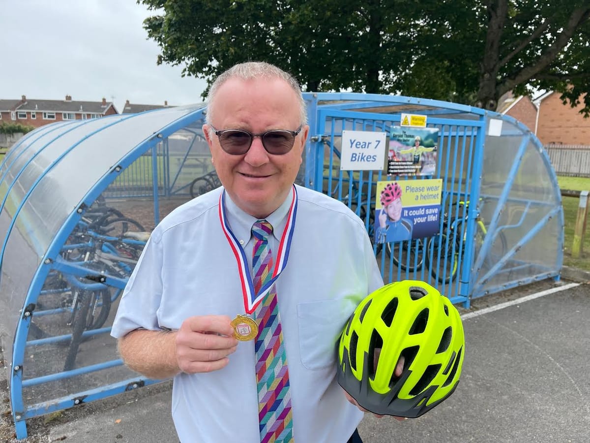 Business leader of multi academy trust of 5000 students smashes cycle ride charity target 