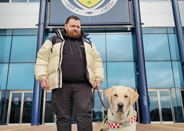 Special recognition from the Scottish Premier Football League for guide dog owner Jon