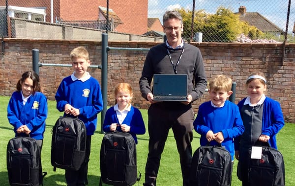 Pupils delight at gift of 10 new laptops