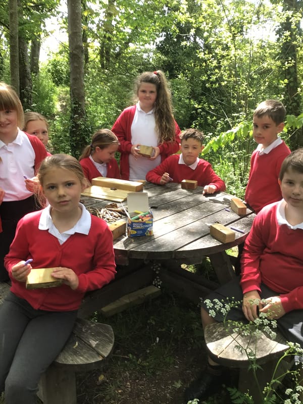 Creative pupils learn maths and multiplication skills using wood blocks in the woods